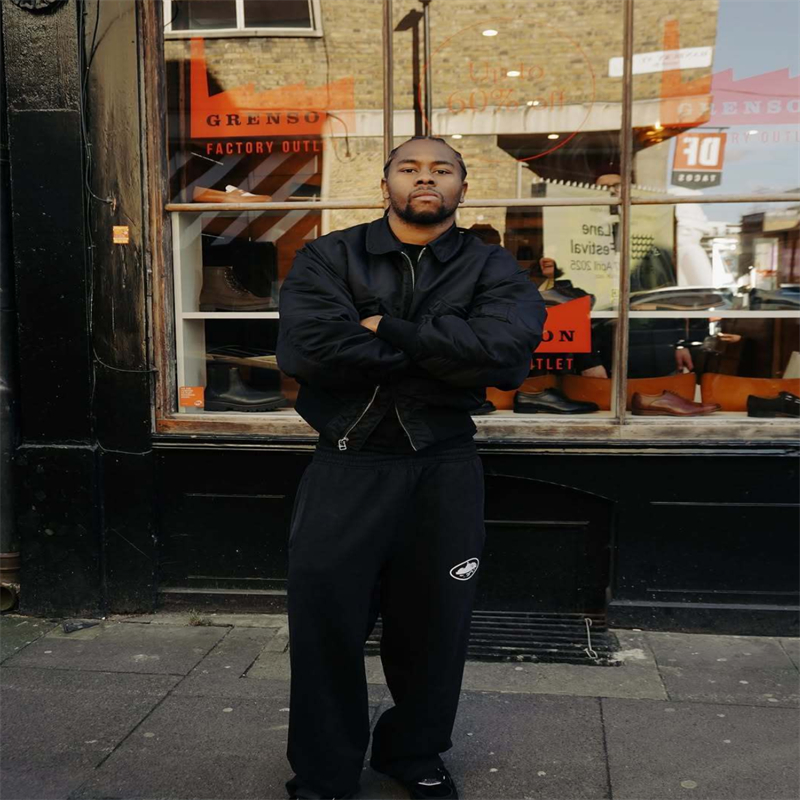 Corteiz Alcatraz Bomber Jacket worn with dark trousers