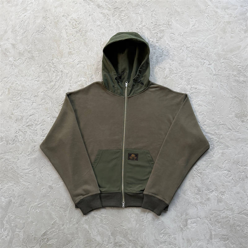Olive Corteiz Guerillaz Ripstop Zip Hoodie shown from the front