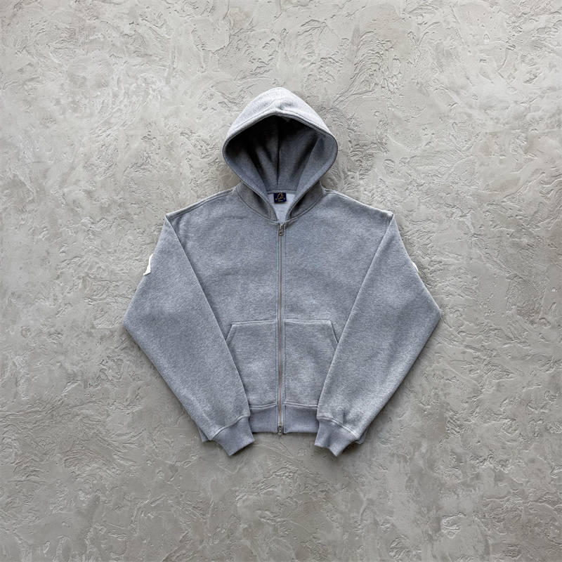 Grey Corteiz Lundun Stitch Zip Hoodie shown from the front