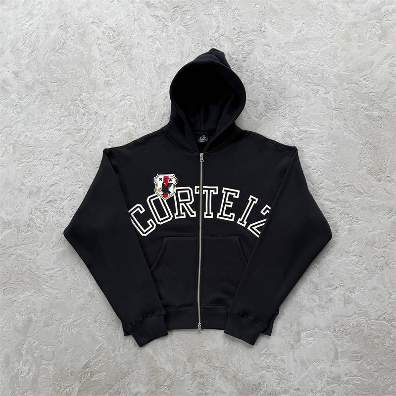 Black Corteiz Arch Shield Zip Hoodie with white chest lettering