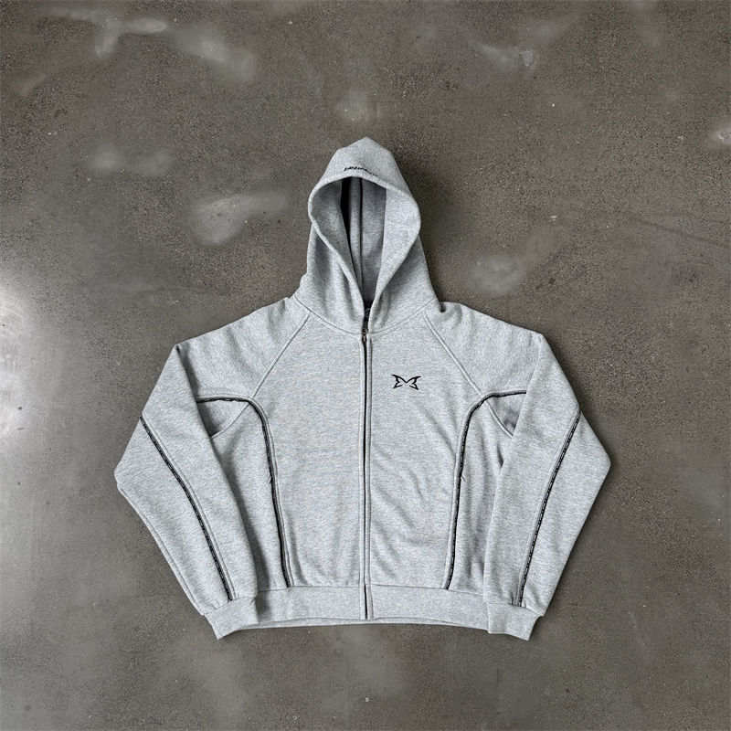 Front flat-lay photo of the grey Mertra Piping zip-up hoodie with curved contrast piping on the sleeves and body